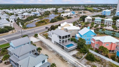 Just steps from the sugar-white sands of the Gulf, this