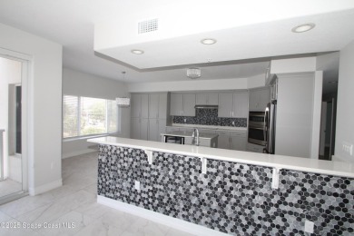 Absolutely pristine corner END UNIT direct Riverfront condo