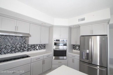 Absolutely pristine corner END UNIT direct Riverfront condo