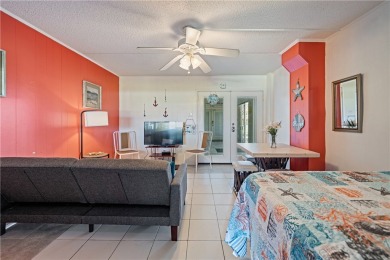 Fully furnished first floor corner condo that offers a compact