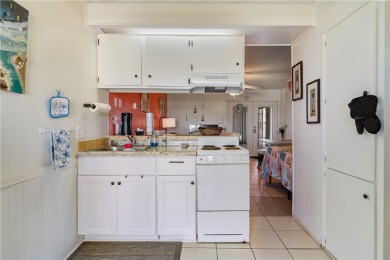 Fully furnished first floor corner condo that offers a compact