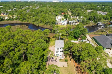 Welcome to your waterfront sanctuary at 95 Bluebell Cir, Santa
