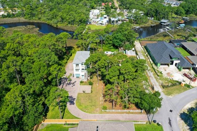 Welcome to your waterfront sanctuary at 95 Bluebell Cir, Santa