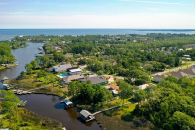 Welcome to your waterfront sanctuary at 95 Bluebell Cir, Santa