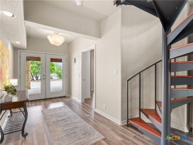 Experience lake living at its finest in this beautifully updated