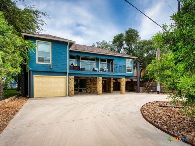 Experience lake living at its finest in this beautifully updated