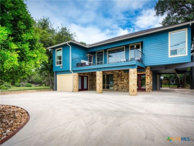 Experience lake living at its finest in this beautifully updated