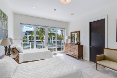 A private tropical oasis--waterfront estate with 150 FT of water