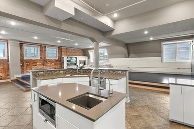 Welcome to Penthouse 401 at 230 N Kalamazoo Mall - where modern