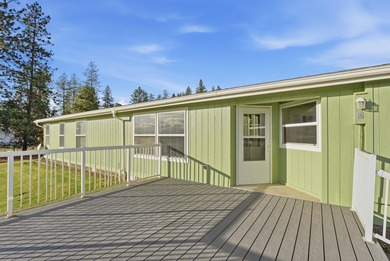 Tucked on nearly five acres in Chattaroy, this 2,800 sq ft home