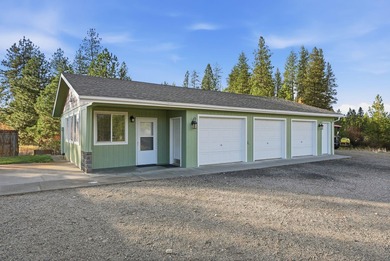 Tucked on nearly five acres in Chattaroy, this 2,800 sq ft home