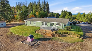 Tucked on nearly five acres in Chattaroy, this 2,800 sq ft home