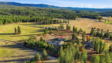 Tucked on nearly five acres in Chattaroy, this 2,800 sq ft home