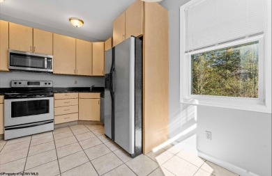 Check out this fantastic corner unit adjacent to the elevator!