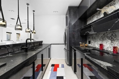 Indulge in luxurious coastal living at this elegantly-remodeled