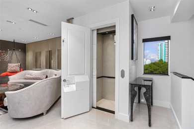 Indulge in luxurious coastal living at this elegantly-remodeled