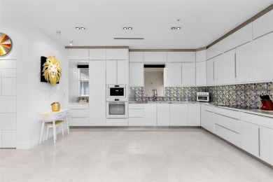 Indulge in luxurious coastal living at this elegantly-remodeled