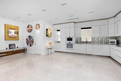 Indulge in luxurious coastal living at this elegantly-remodeled