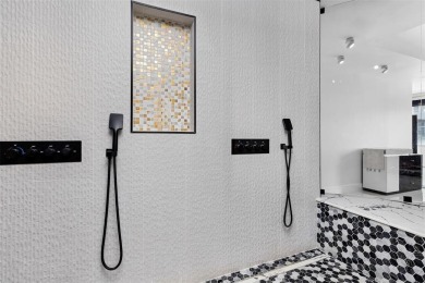 Indulge in luxurious coastal living at this elegantly-remodeled