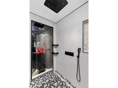 Indulge in luxurious coastal living at this elegantly-remodeled