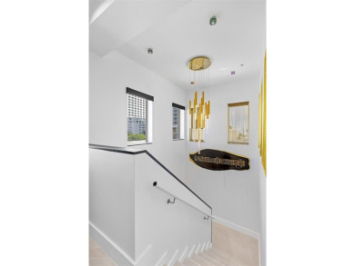 Indulge in luxurious coastal living at this elegantly-remodeled