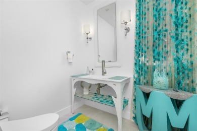 Indulge in luxurious coastal living at this elegantly-remodeled