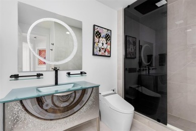 Indulge in luxurious coastal living at this elegantly-remodeled