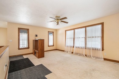 This sprawling custom-built walkout ranch just outside of