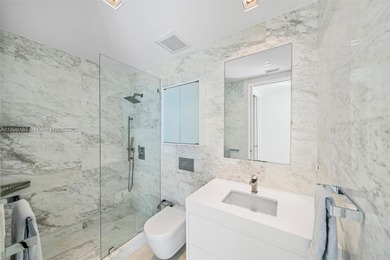 Experience the pinnacle of oceanfront living, a turnkey 4-bdrm