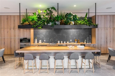 Positioned on a premier penthouse level, this residence