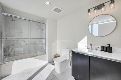 Experience luxury in this fully renovated corner-unit sky