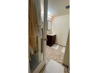 ***Garden Level 2/2 Condo with the Convenience of a House***
