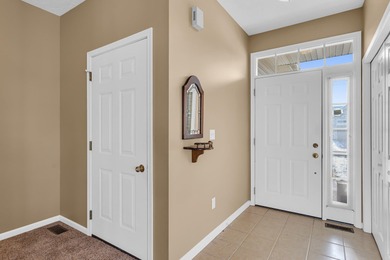 SOUGHT AFTER STAND ALONE CONDO IN SUMMIT TOWNSHIP! Striking curb