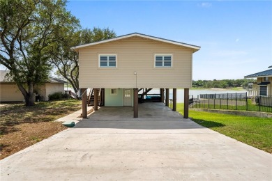 Welcome to your fully renovated lakefront retreat on beautiful