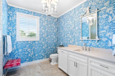 Experience coastal living at its finest in this stunning canal