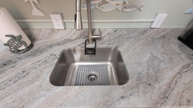 Elevate your beachside getaway with this beautiful efficiency