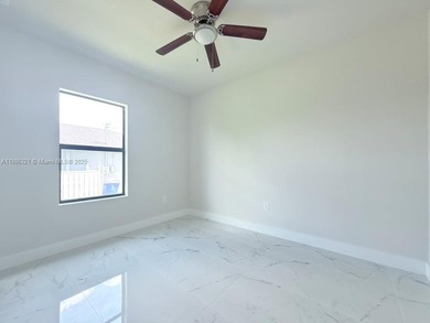 Welcome to your dream home in Lehigh Acres! This elegant