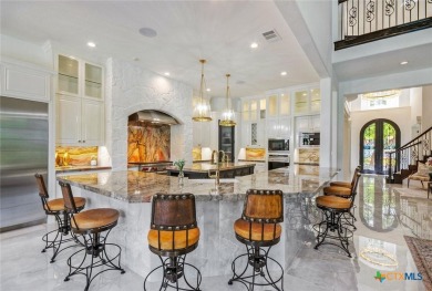 Set on a rare double lot overlooking the scenic Avery Ranch Golf