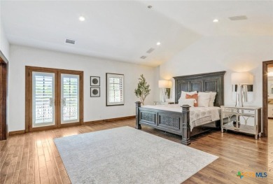 Set on a rare double lot overlooking the scenic Avery Ranch Golf