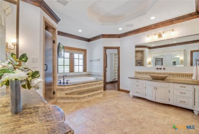 Set on a rare double lot overlooking the scenic Avery Ranch Golf