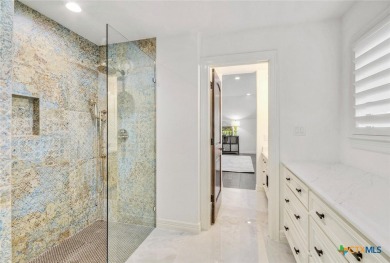 Set on a rare double lot overlooking the scenic Avery Ranch Golf