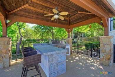 Set on a rare double lot overlooking the scenic Avery Ranch Golf