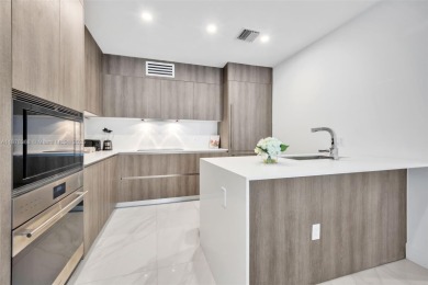 Experience breathtaking oceanfront living in this elegant