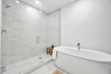 Experience breathtaking oceanfront living in this elegant