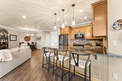 Step into low-maintenance living where the lake is your backdrop