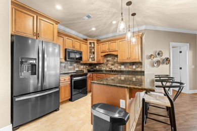 Step into low-maintenance living where the lake is your backdrop