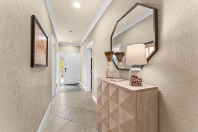 Step into low-maintenance living where the lake is your backdrop