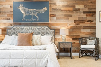 Step into low-maintenance living where the lake is your backdrop