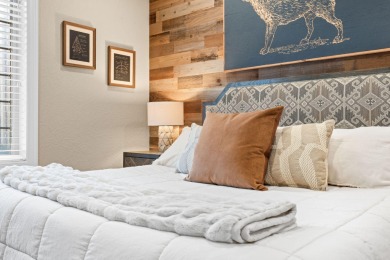 Step into low-maintenance living where the lake is your backdrop