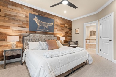 Step into low-maintenance living where the lake is your backdrop